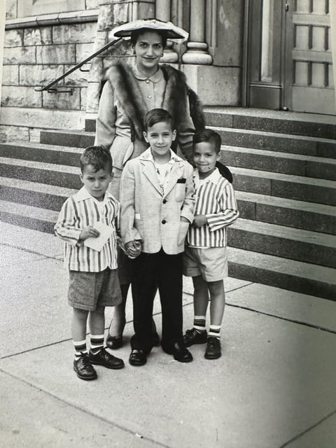 Robert Prevost, left, and his brothers John and Louis pose for a photo with their mother in this undated photo.