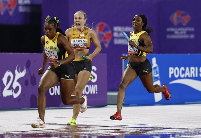 Athletics - World Athletics Relays 2025 - Guangdong Olympic Stadium, Guangzhou, China - May 10, 2025 Jamaica's Shelly-Ann Fraser-Pryce and Tia Clayton, Germany's Nele Jaworski in action during the women's 4x100 metres relay - heat 2 REUTERS/Tingshu Wang