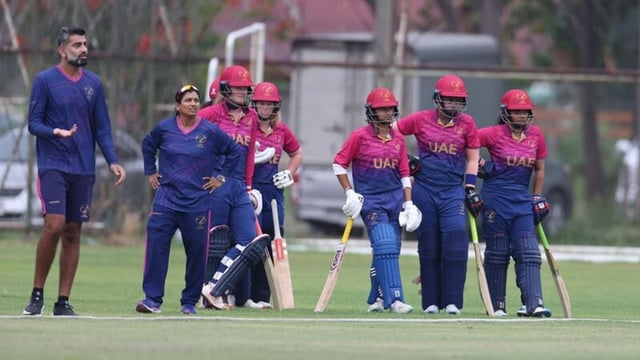 UAE batters wait on the boundary line to sprint on to pitch and retire out as the team tries to gain extra time ahead of a rain delay in a T20 Women's World Cup Asia Region qualifier.
