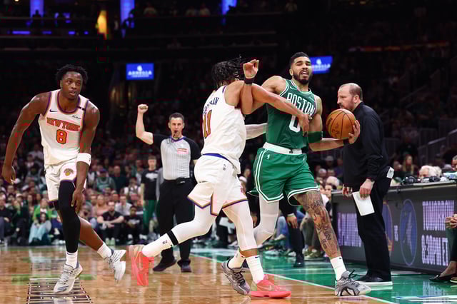Jayson Tatum #0 of the Boston Celtics is fouled by Jalen Brunson #11 of the New York Knicks during the third quarter in Game Two of the Eastern Conference Second Round NBA Playoffs at TD Garden on May 07, 2025 in Boston, Massachusetts.