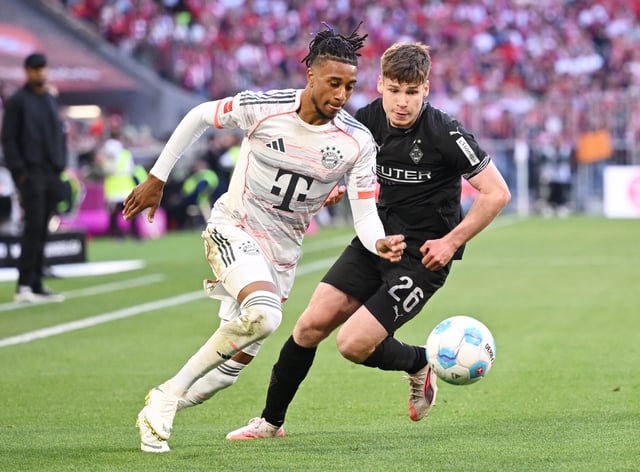 Soccer Football - Bundesliga - Bayern Munich v Borussia Moenchengladbach - Allianz Arena, Munich, Germany - May 10, 2025 Bayern Munich's Michael Olise in action with Borussia Moenchengladbach's Lukas Ullrich REUTERS/Angelika Warmuth