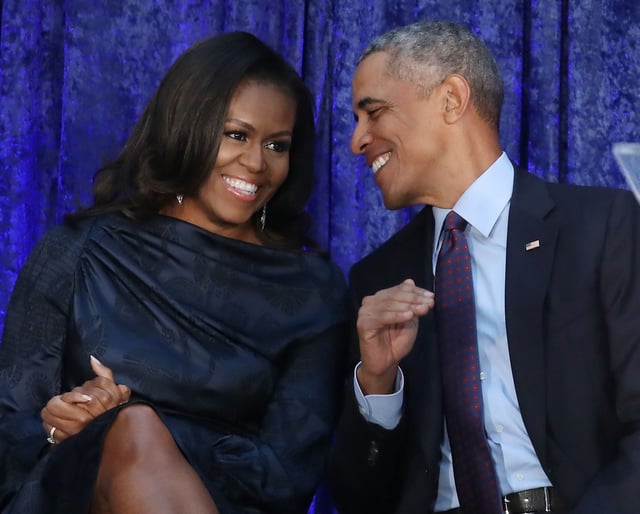 Former U.S. President Barack Obama and first lady Michelle Obama participate in the unveiling of their official portraits during a ceremony at the Smithsonian's National Portrait Gallery in 2018.