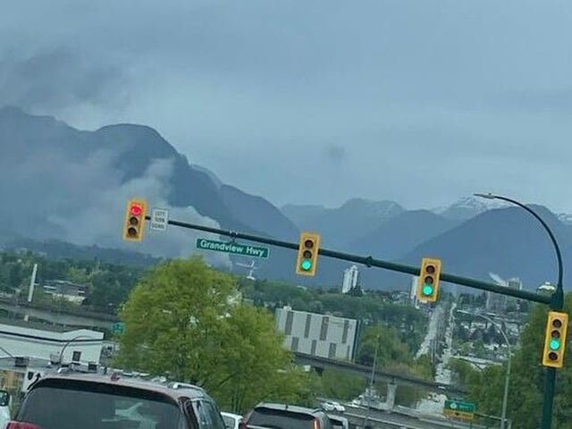  Firefighters are on scene at a 2nd alarm structure fire in Lynn Valley. Smoke is seen from east Vancouver. Handout photo.