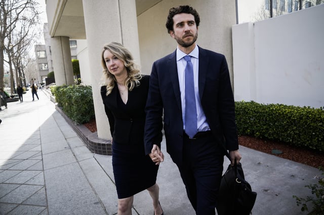 Former Theranos CEO Elizabeth Holmes alongside her boyfriend Billy Evans, leaves a hearing at the Robert E. Peckham U.S. Courthouse on March 17, 2023 in San Jose, California.