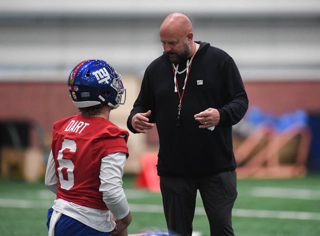 May 9, 2025; East Rutherford, NJ, USA; New York Giants head coach Brian Daboll talks with quarterback Jaxson Dart (6) during rookie minicamp at Quest Diagnostics Training Center. Mandatory Credit: John Jones-Imagn Images