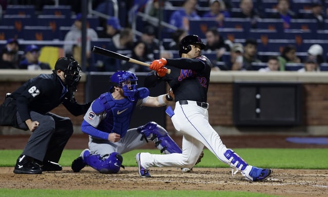 Juan Soto #22 of the New York Mets follows through on his fourth inning home run against the Chicago Cubs at Citi Field on May 09, 2025 in New York City. The Mets defeated the Cubs 7-2.