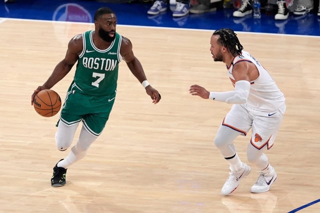 Boston Celtics&#39; Jaylen Brown, left, dribbles the ball against New York Knicks&#39; Jalen Brunson, right, during the second half of Game 3 of an NBA basketball second-round playoff series, Saturday, May 10, 2025, in New York. (AP Photo/Pamela Smith)