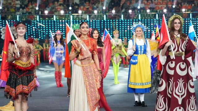 Miss India Nandini Gupta along with participants of 110 countries walk the ramp holding their national flags on Saturday. (HT photo)