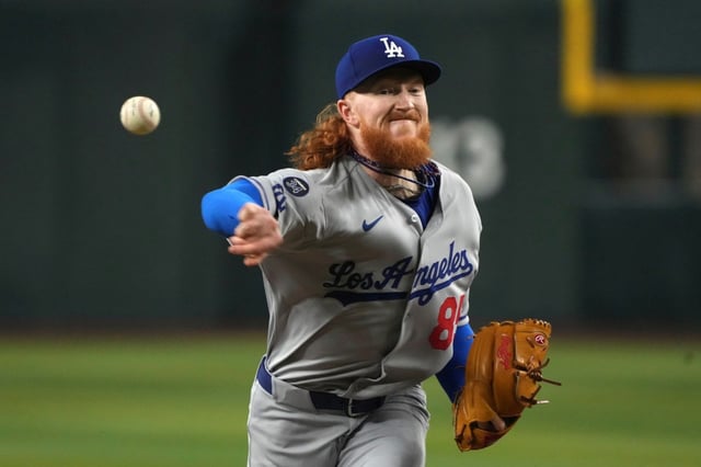 Dodgers pitcher Dustin May throws against the Arizona Diamondbacks in the first inning during a baseball game, Saturday, May 10, 2025, in Phoenix. (AP Photo/Rick Scuteri)