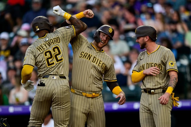 DENVER, CO – MAY 10: San Diego Padres outfielder Jason Heyward (22) celebrates his fourth inning three-run home run with Gavin Sheets (30) and Jackson Merrill (3) during a game between the San Diego Padres and the Colorado Rockies at Coors Field on May 10, 2025 in Denver, Colorado. (Photo by Dustin Bradford/Icon Sportswire via Getty Images)