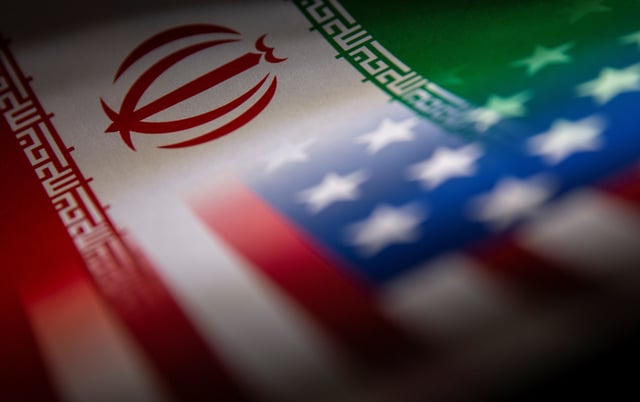 Iran's and U.S.' flags are seen printed on paper in this illustration taken January 27, 2022. REUTERS/Dado Ruvic/Illustration/File Photo