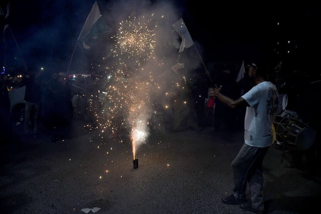 People celebrate after the ceasefire announcement between India and Pakistan, in Hyderabad, Pakistan, May 10, 2025. REUTERS/Yasir Rajput