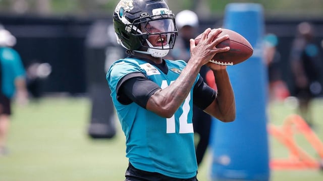 May 10, 2025; Jacksonville, FL, USA; Jacksonville Jaguars wide receiver Travis Hunter (12) completing a passing drill during rookie minicamp at Miller Electric Center.