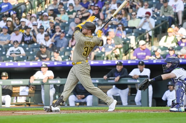 May 10, 2025; Denver, Colorado, USA; San Diego Padres first base Gavin Sheets (30) hits a home run in the first inning against the Colorado Rockies at Coors Field. John Leyba-Imagn Images