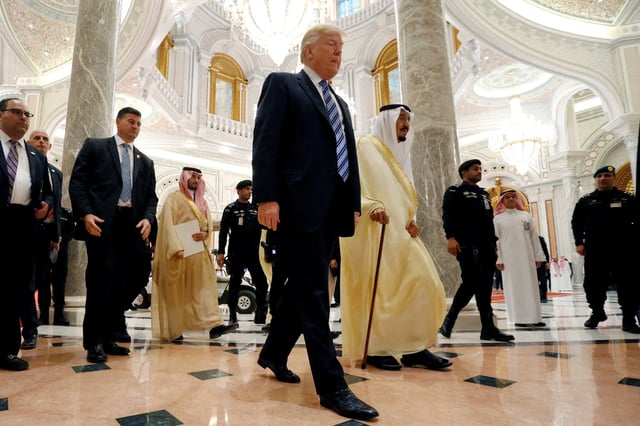 U.S. President Donald Trump walks with Saudi Arabia's King Salman bin Abdulaziz Al Saud in Riyadh, May 21, 2017. REUTERS/Jonathan Ernst/File Photo