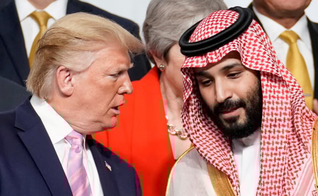 U.S. President Donald Trump speaks with Saudi Arabia's Crown Prince Mohammed bin Salman at a G20 summit in Japan, June 28, 2019.  REUTERS/Kevin Lamarque/File Photo
