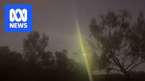 A yellow flash of light in the sky.