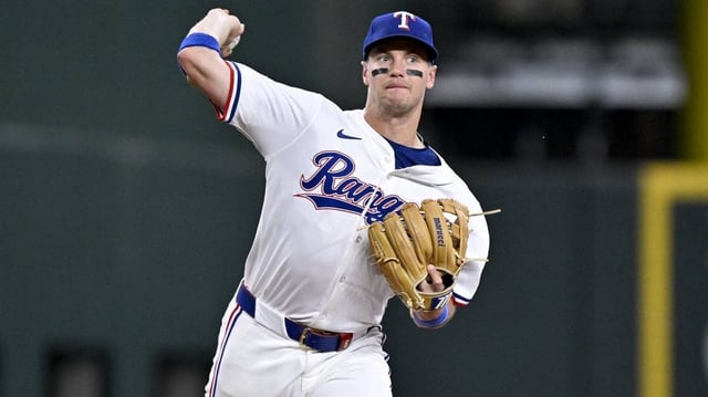 May 1, 2025; Arlington, Texas, USA; Texas Rangers third baseman Josh Jung (6) throws out Athletics catcher Jhonny Pereda (not pictured) during the fifth inning at Globe Life Field. Mandatory Credit: Jerome Miron-Imagn Images
