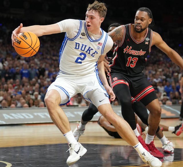 Duke forward Cooper Flagg (2) is defended by Houston forward J'Wan Roberts (13) during the national semifinals of the 2025 NCAA men's tournament at the Alamodome.