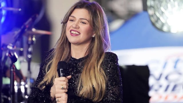 Kelly Clarkson informed her Atlantic City, New Jersey, audience that her hectic daytime TV schedule makes it impractical for her to depart on tour.. (Photo by Charles Sykes/Invision/AP)