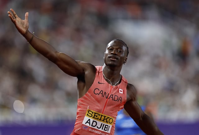Athletics - World Athletics Relays 2025 - Guangdong Olympic Stadium, Guangzhou, China - May 11, 2025 Canada's Eliezer Adjibi celebrates after winning the mixed 4x100 metres relay final REUTERS/Tingshu Wang