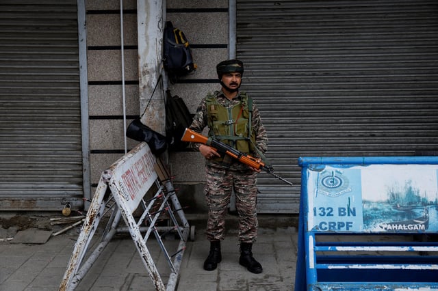 An Indian security personnel stands guard on a street, following clashes between India and Pakistan, in Srinagar, Kashmir May 9, 2025. REUTERS/Sharafat Ali