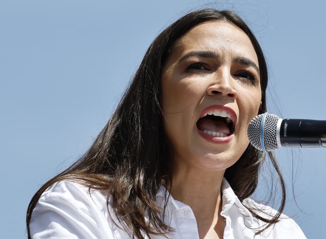Alexandria Ocasio-Cortez speaks during a stop on the ‘Fighting Oligarchy’ tour with U.S. Senator Bernie Sanders at Grand Park on April 12, 2025 in Los Angeles, California.