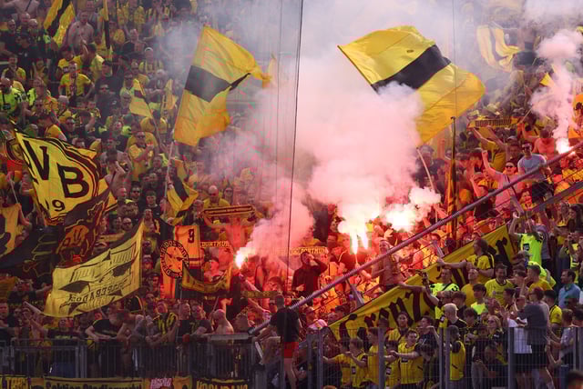 Soccer Football - Bundesliga - Bayer Leverkusen v Borussia Dortmund - BayArena, Leverkusen, Germany - May 11, 2025 Borussia Dortmund fans celebrate after Karim Adeyemi scored their third goal REUTERS/Thilo Schmuelgen