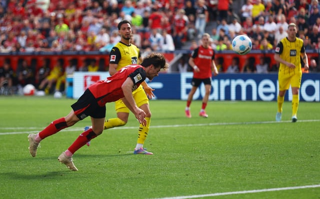 Soccer Football - Bundesliga - Bayer Leverkusen v Borussia Dortmund - BayArena, Leverkusen, Germany - May 11, 2025 Bayer Leverkusen's Jonas Hofmann scores their second goal REUTERS/Thilo Schmuelgen