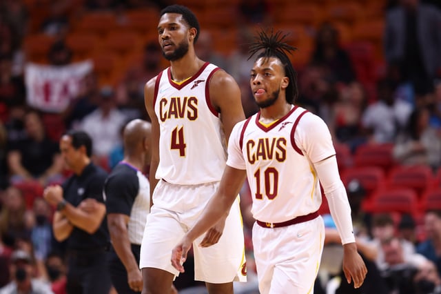 MIAMI, FLORIDA - MARCH 11: Evan Mobley #4 and Darius Garland #10 of the Cleveland Cavaliers look on against the Miami Heat during the first half at FTX Arena on March 11, 2022 in Miami, Florida.