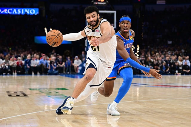 Jamal Murray #27 of the Denver Nuggets drives against Shai Gilgeous-Alexander #2 of the Oklahoma City Thunder during the second half at Paycom Center on January 31, 2024 in Oklahoma City, Oklahoma.