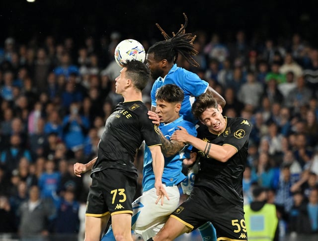 Soccer Football - Serie A - Napoli v Genoa - Stadio Diego Armando Maradona, Naples, Italy - May 11, 2025 Napoli's Andre-Frank Zambo Anguissa and Mathias Olivera in action with Genoa's Patrizio Masini and Alessandro Zanoli REUTERS/Alberto Lingria