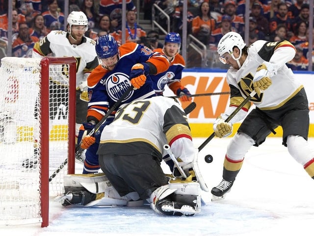 The Edmonton Oilers' Viktor Arvidsson (33) battles the Vegas Golden Knights' goalie Adin Hill (33) and Zach Whitecloud (2) during first period NHL playoff action at Rogers Place, in Edmonton on Saturday, May 10, 2025. Vegas won 4-3. 