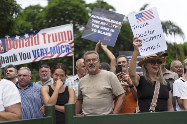FILE - White South Africans demonstrate in support of U.S. President Donald Trump in front of the U.S. embassy in Pretoria, South Africa, Feb. 15, 2025. (AP Photo/Jerome Delay, File)