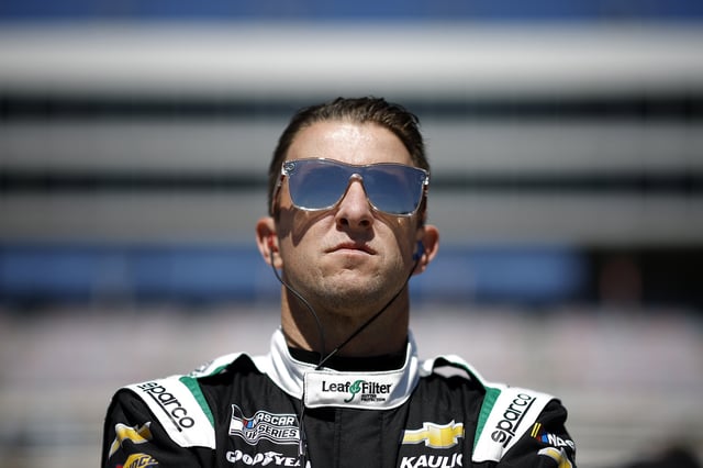 AJ Allmendinger, driver of the #16 LeafFilter Gutter Protection Chevrolet, looks on during qualifying for the NASCAR Cup Series Würth 400 at Texas Motor Speedway on May 03, 2025 in Fort Worth, Texas.