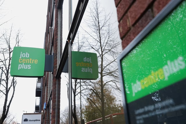 Signs are seen outside a job centre in Borough, in London, Britain, December 1, 2024. REUTERS/Mina Kim