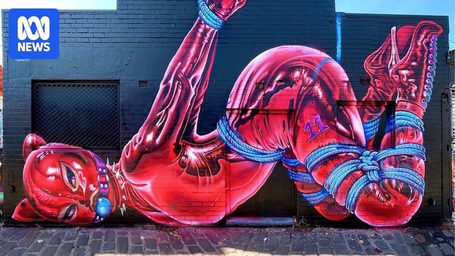 A mural depecting a bound woman wearing a ball gag