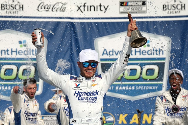 Kyle Larson, driver of the #5 HendrickCars.com Chevrolet, celebrates in victory lane after winning the NASCAR Cup Series AdventHealth 400 at Kansas Speedway on May 11, 2025 in Kansas City, Kansas.