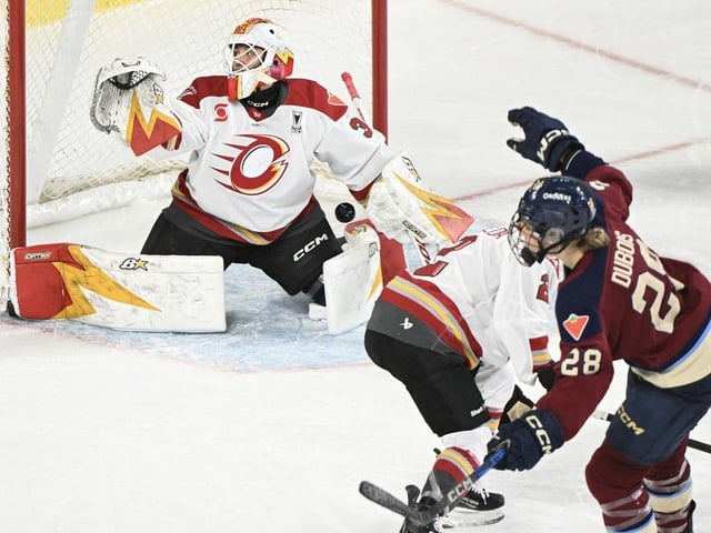 Montreal Victoire's Catherine Dubois scores against Ottawa Charge goaltender Gwyneth Philips during the fourth overtime period in Laval, Que., on Sunday, May 11, 2025.