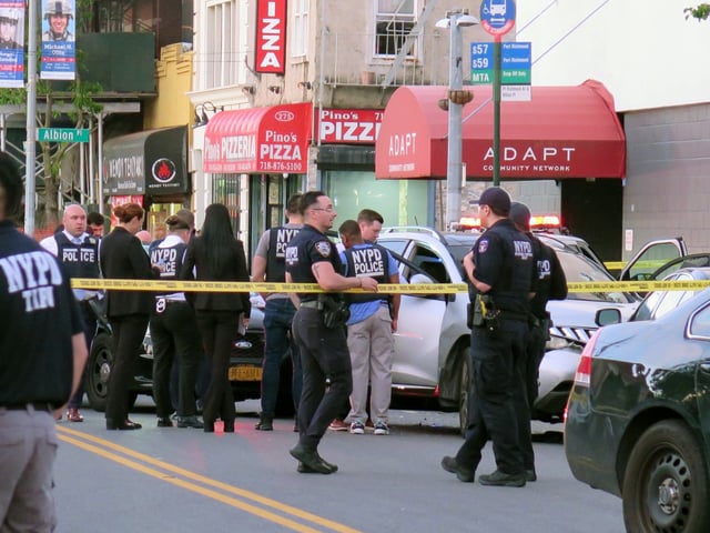 Police on the scene of a shooting on Port Richmond Avenue and Albion Place in Staten Island, New York on Sunday, May 11, 2025. (Rose Abuin/New York Daily News)