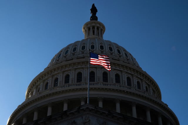 A US flag flies near the dome of the US Capitol in Washington, DC, on February 25, 2025.