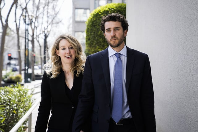 SAN JOSE, CA - MARCH 17: Former Theranos CEO Elizabeth Holmes alongside her boyfriend Billy Evans, leaves a hearing at the Robert E. Peckham U.S. Courthouse on March 17, 2023 in San Jose, California. Holmes appeared in court for a restitution hearing. (Photo by Philip Pacheco/Getty Images)