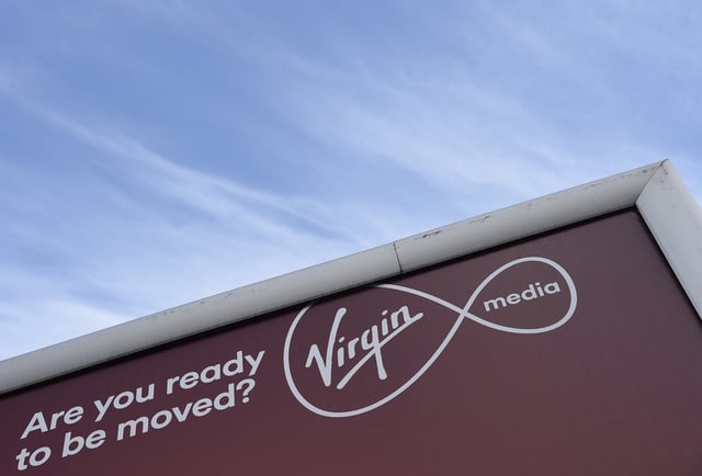 A billboard advertising Virgin media fibre broadband is seen in London, Britain, March 30, 2016. REUTERS/Toby Melville/File Photo