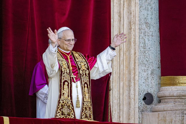 Newly elected Pope Leo XIV, formerly Cardinal Robert Francis Prevost, appears on the central loggia of St. Peter's Basilica at the Vatican shortly after his election as the 267th pontiff of the Roman Catholic Church, Thursday, May 8, 2025. (AP Photo/Domenico Stinellis)