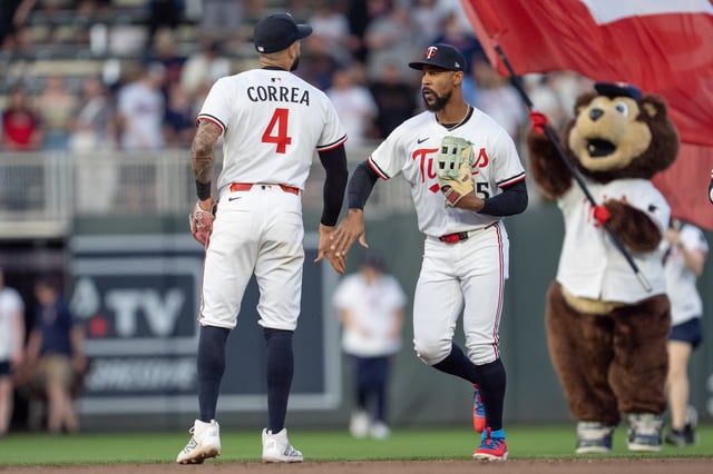 Carlos Correa and Byron Buxton celebrate a win over the Giants.