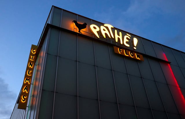 A logo is pictured on a Pathe! cinema in Lausanne, Switzerland, December 7, 2020. REUTERS/Denis Balibouse/File Photo