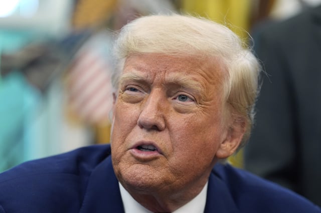 President Donald Trump speaks with reporters as he signs an executive order in the Oval Office of the White House, Friday, May 9, 2025, in Washington.
