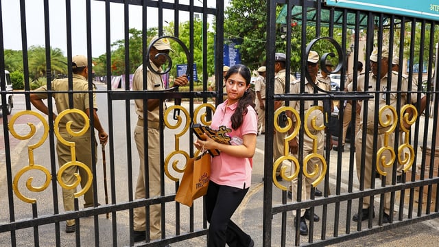A woman exits Sawai Mansingh Stadium amid evacuation after a bomb threat e-mail, in Jaipur, Thursday, May 8, 2025.