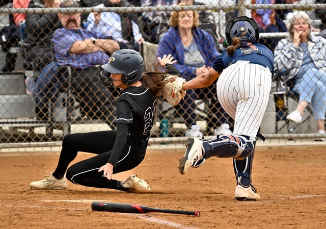 Cypress High catcher Naya Taylor (2) forces Pacifica’s Audrena Duran (20) away from the plate as she tags her at home during their Crestview League game in Cypress, CA, on Tuesday, May 6, 2025. The Centurions beat the Mariners, 1 to 0 in 9 innings. (Photo by Jeff Gritchen, Orange County Register/SCNG)
