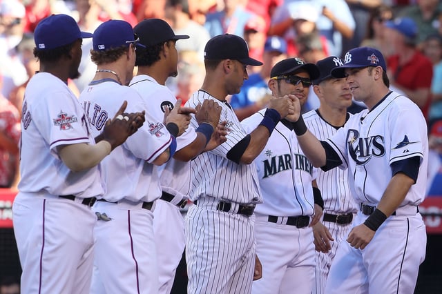 American League All-Star Evan Longoria #3 of the Tampa Bay Rays greets his teammates on American League All-Star prior to the 81st MLB All-Star Game at Angel Stadium of Anaheim on July 13, 2010 in Anaheim, California.